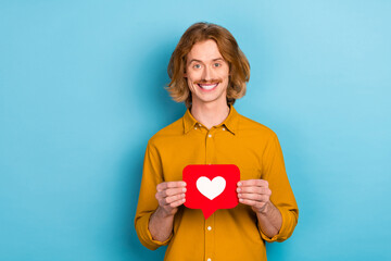 Portrait of attractive cheerful long-haired guy holding in hand like card yes chat isolated over...