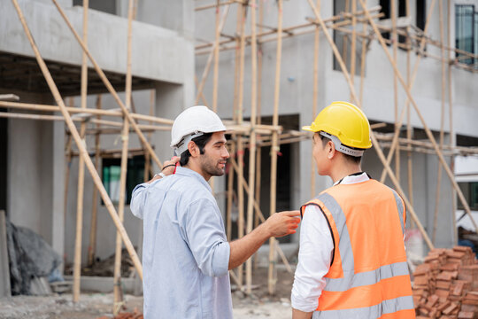 The engineer manager and foremen discussed the site projects on the construction site to check the various functions.