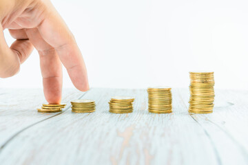 business and finance investment and saving activity with gold coin arrange on white isolated with...