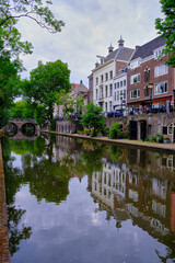 Obraz premium Utrecht, The Netherlands - June 07 2022: Historic houses on the Oudegracht canal with clear reflections.