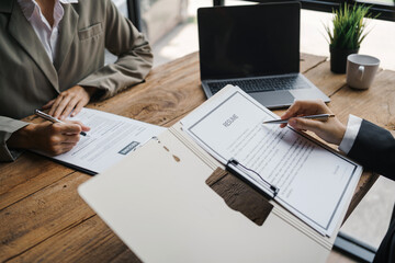 Close-up of business owner check resume of job applicants in company at the office.