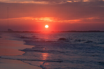 Ocean waves at sunrise off the shore of Cape May , New Jersey USA