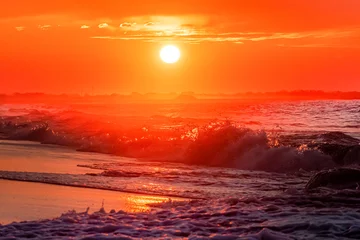 Fotobehang Ocean waves at sunrise off the shore of Cape May , New Jersey USA © John McAdorey