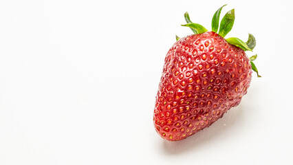 close-up red bright strawberries on a white background