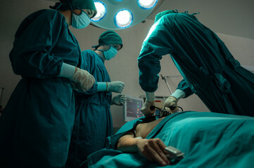 professional surgeon doctor teamwork person working in hospital operation room with surgery medical health equipment with surgical patient and nurse, emergency medicine treatment clinic concept