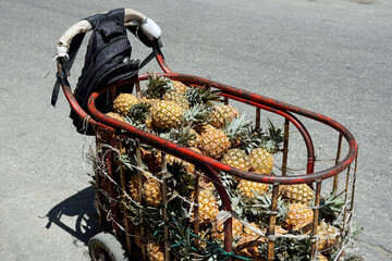small market cart in the streets of havana selling pineapples
