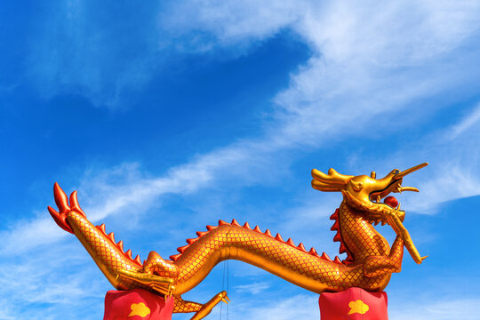 Inflatable Chinese dragon against the blue sky, copy space. Year of the dragon