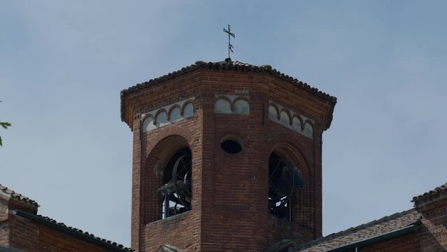 Bells ringing in the bell tower of the Italian romanic abbey, with sound