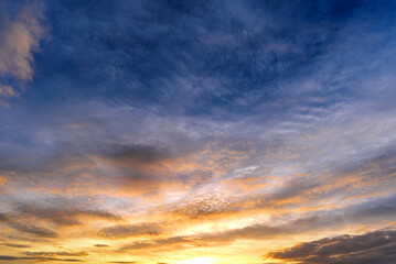 Naklejka na ściany i meble dramatic blue sky with white clouds at sunrise