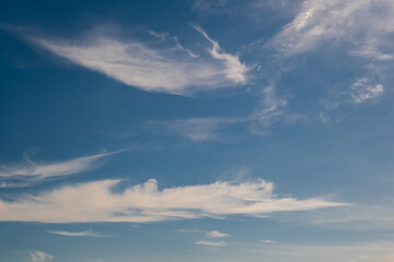 blue sky panorama may use for sky replacement. blue sky background with white striped clouds in heaven and infinity.