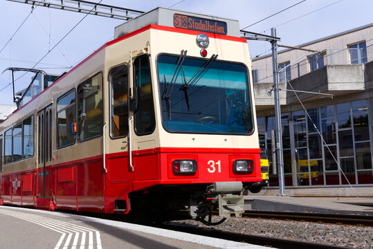 Train of Forch Railway at railway station Forch, Canton Z&uuml;rich, on a sunny summer day. Photo taken June 8th, 2022, Forch, Switzerland.