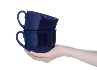 Two big blue cups mugs in hand on white background isolation