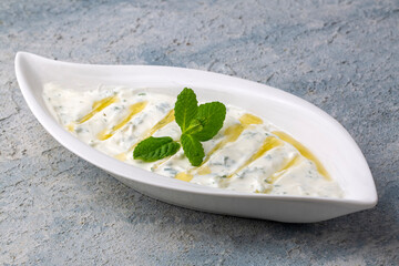 Haydari is a type of yogurt made from certain herbs and spices, combined with garlic. Turkish cuisine.