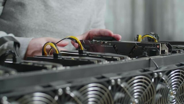 Close Up Of Man'S Hands Build The Mining Rig For Mining Cryptocurrency
