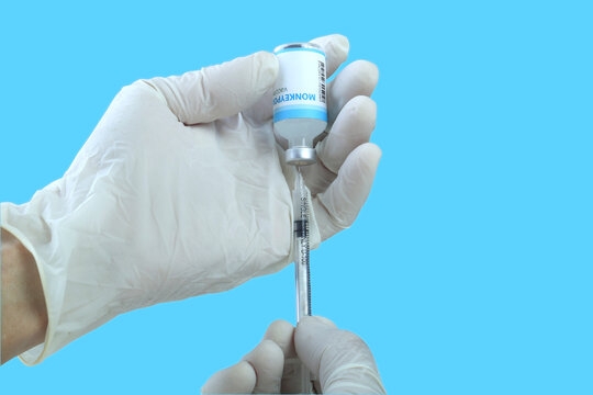 Monkeypox vaccine in researcher hands.