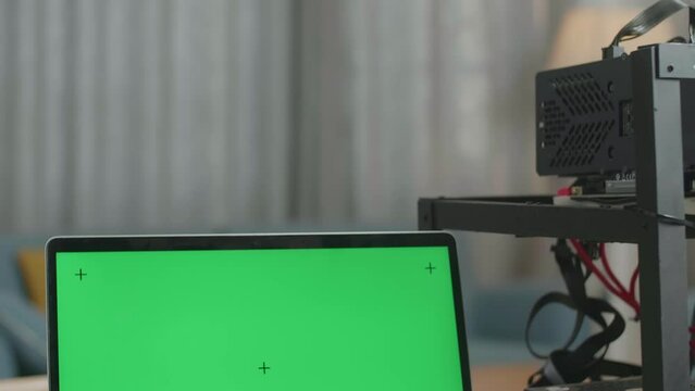Close Up Of Green Screen Laptop And Mining Rig On The Table For Cryptocurrency Mining 
