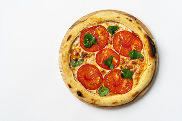 Italian pizza with cherry tomatoes and green basil on white background