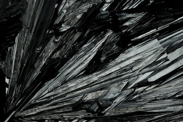 Stibnite (or called antimonite) close-up, sulfide mineral, detail grey material crystallizes uncut...