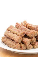 Meat kebabs on the plate with copy space above white background