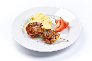 pork kebab with mashed potato and vegetables