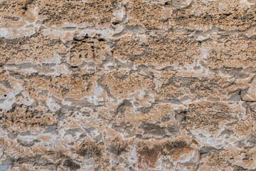 Detail of stone texture for background. Surface of the marble with brown tint