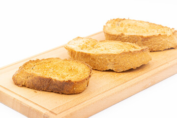 Baked bread with olive oil on the baking pan