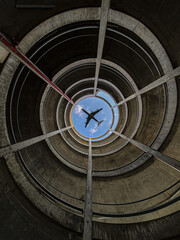 Plane above parking lot