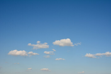 Blue beautiful sky with white clouds in sunny day