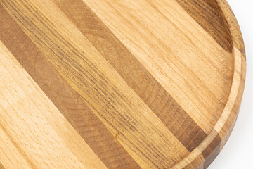 Wooden plate made of walnut cherry and beech isolated above white background
