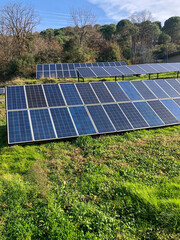 Row of solar panels, sustainable energy source on the field 