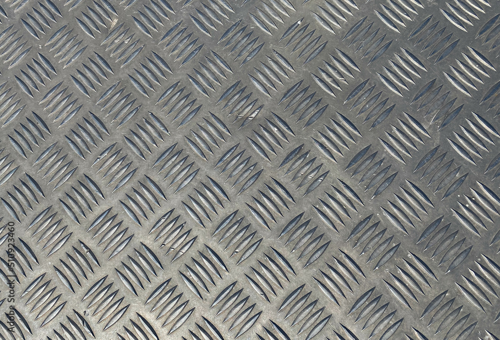 Aufkleber metal texture. voluminous background with convex notches of a square shape. background, gray metal w