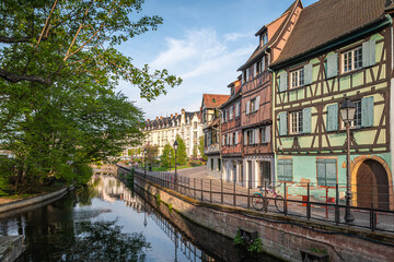 Traditional old alsatian houses in "Petit Venice" (Small Venice) Colmar in Alsace in the department of Haut-Rhin of the Grand Est region of France - Powered by Adobe