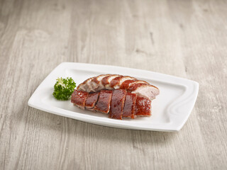 Crispy Roasted Irish Fat Duck (Regular) Served in a dish isolated on wooden board side view on grey background