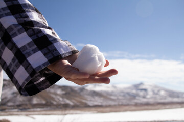 Snowball in hand