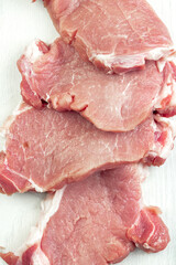 Raw veal meat fillet on white background top view, overhead, flat lay.