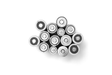 Bunch old used batteries, top view white background.