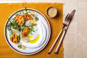 Labneh middle eastern lebanese cream cheese dip. Fennel apricot grilled barbecue salad with Labneh. Top view, overhead
