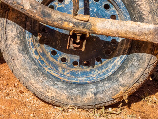Monte Verde, Minas gerais, Brazil - June13 2022: very dirty and rusty wheel of a wheelbarrow. Field work.