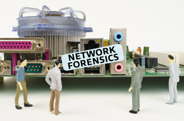 Figures of people are standing near the motherboard and looking at the sticker with the inscription - Network Forensics