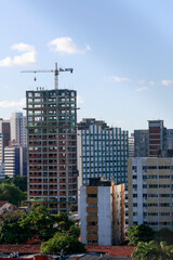 Obraz na płótnie Canvas RECIFE - BRAZIL, 14, June, 2022. View of a building under construction in the neighborhood of Boa Vista, central region of the city of Recife, which has been receiving several housing developments.