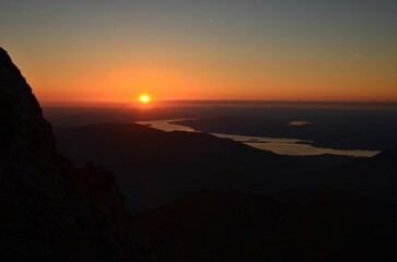 sunset over zurich. Beautiful sunset over lake zurich observed from the swiss mountains. High quality photo