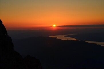 sunset over zurich. Beautiful sunset over lake zurich observed from the swiss mountains. High quality photo