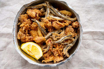 Spanish sea food, cripsy deep fried baby octopus, fish, calamari rings served with lemon