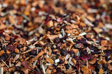 Blended black leaf dry tea with aromatic flowers, spices in tea shop in Andalusia, Spain
