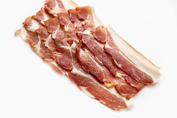 Parma ham slices isolated on white