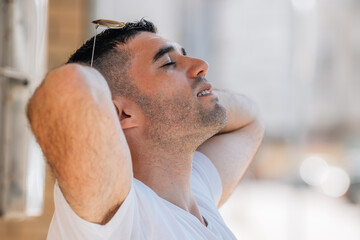 Obraz premium man breathing relaxed outdoors in summer