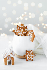 Christmas composition with gingerbread cookies and marshmallow in a white mug. Cozy home atmosphere, delicious sweet holiday dessert. Traditional spices: cinnamon, anise, cardamom