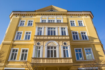 Fototapeta na wymiar Colorful yellow facade of a historic building in Aschersleben, Germany