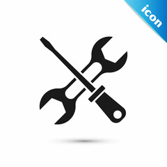 Grey Screwdriver and wrench spanner tools icon isolated on white background. Service tool symbol. Vector