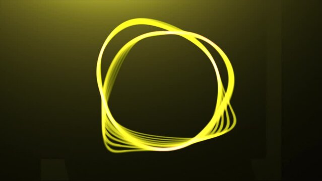 Abstract flexible ring isolated on a dark background. Motion. Transforming circle silhouette with moving shapes.